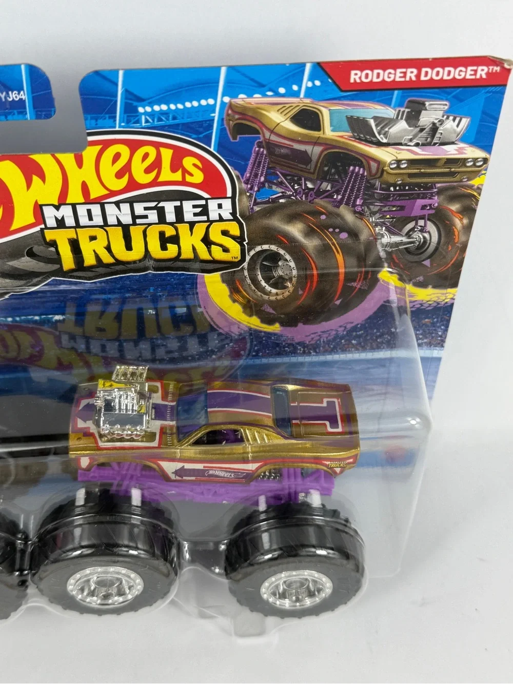 Hot Wheels monster trucks, Pink Dodge Charger, and Purple Roger Dodger. New